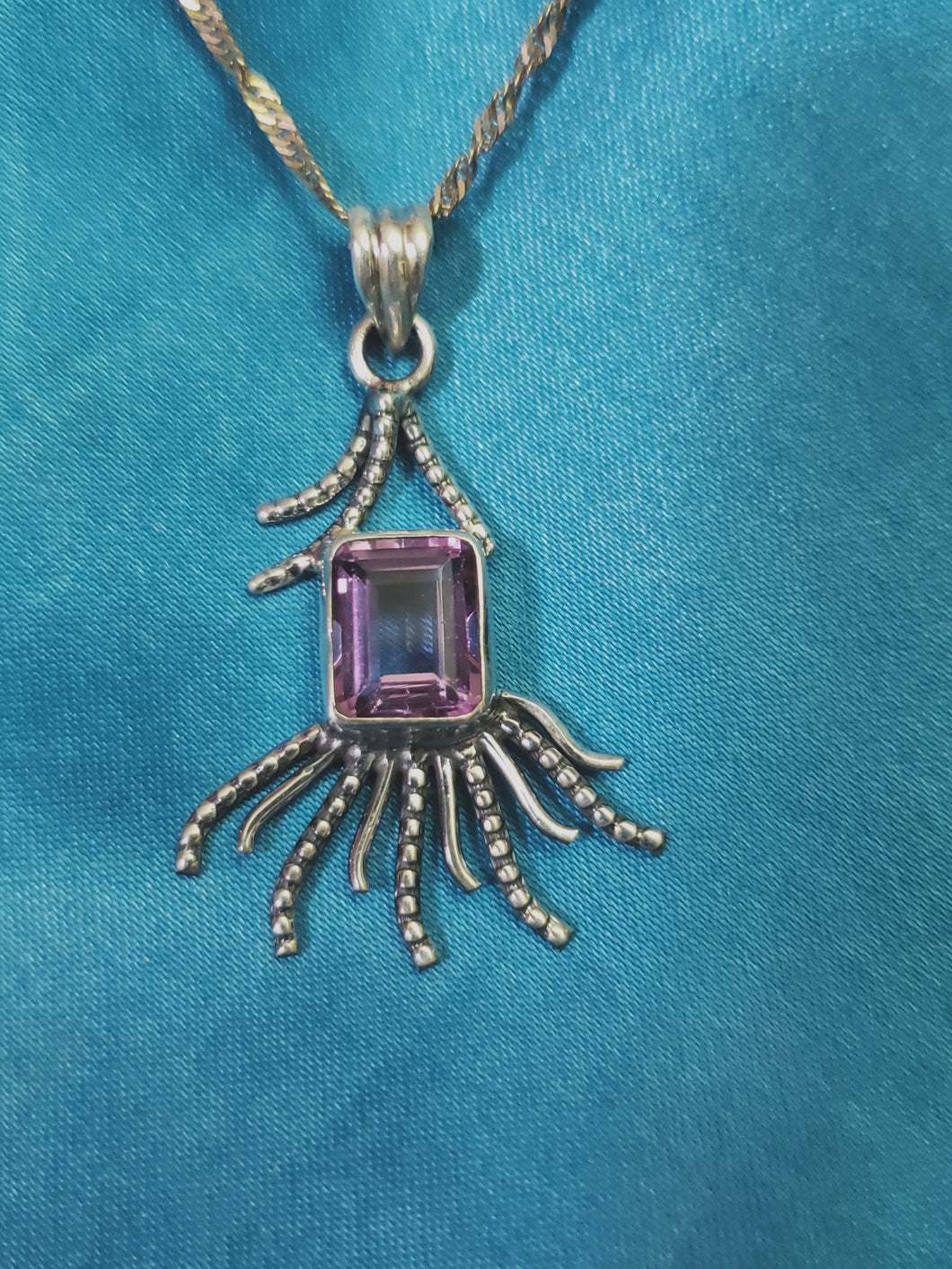 4 carat color-changing synthetic Alexandrite and 925 sterling silver pendant.