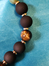 Load image into Gallery viewer, Red, black, green, and tiger&#39;s eye bracelet.
