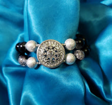 Load image into Gallery viewer, Black and silver double-strand bracelet with crystal focal point.
