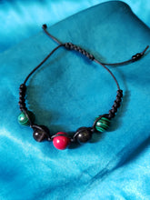 Load image into Gallery viewer, Red, black, and green Shamballa bracelet.
