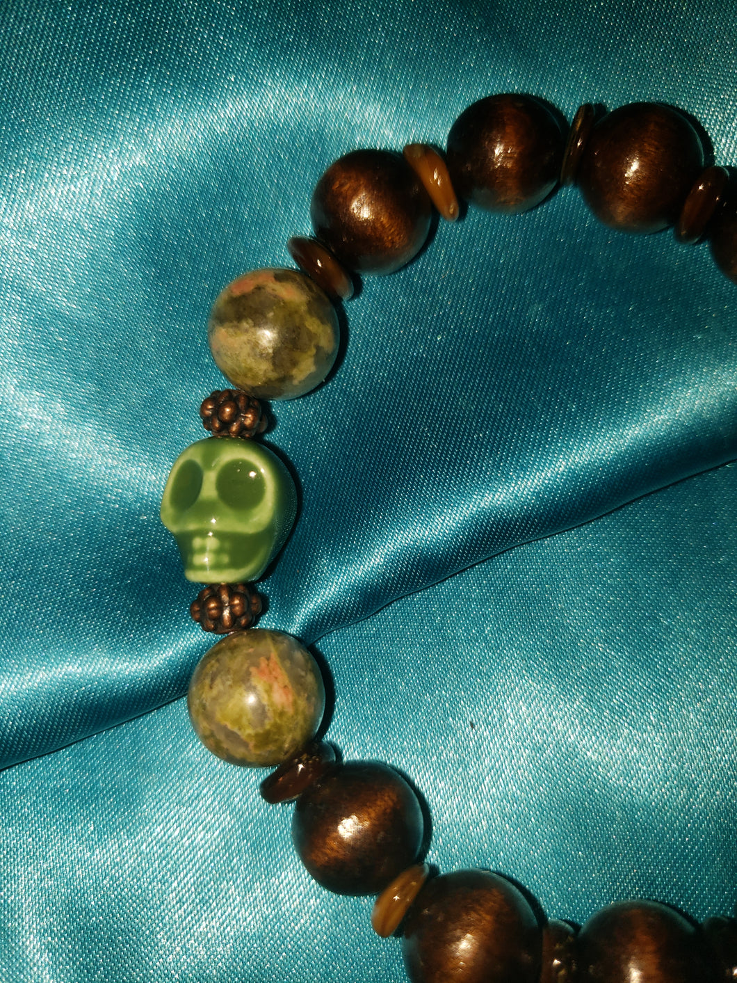 Wooden beads with jasper and green ceramic skull bracelet.
