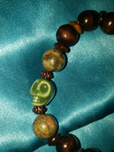 Load image into Gallery viewer, Wooden beads with jasper and green ceramic skull bracelet.
