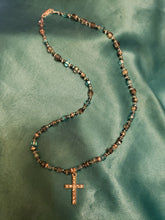 Load image into Gallery viewer, Blue glass bead necklace with crystal cross pendant.
